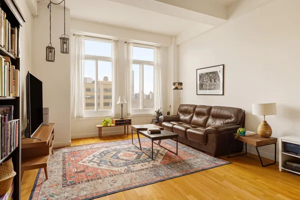 a living room with furniture or couch and a flat screen tv