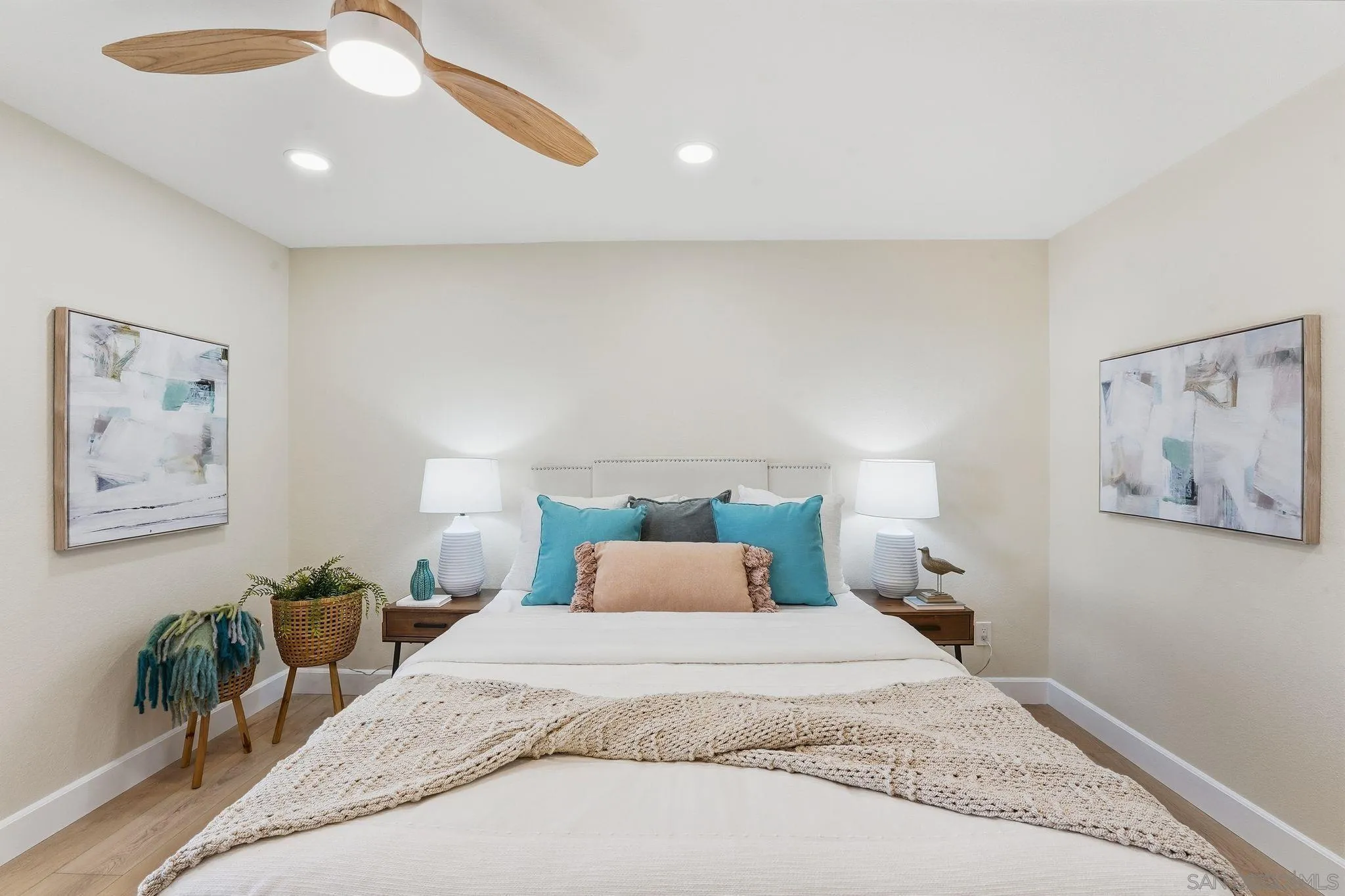 8480 New Salem Street, Unit 103 San Diego, CA 92126 - Photo 15 of 29 a bedroom with a bed and a painting on the wall