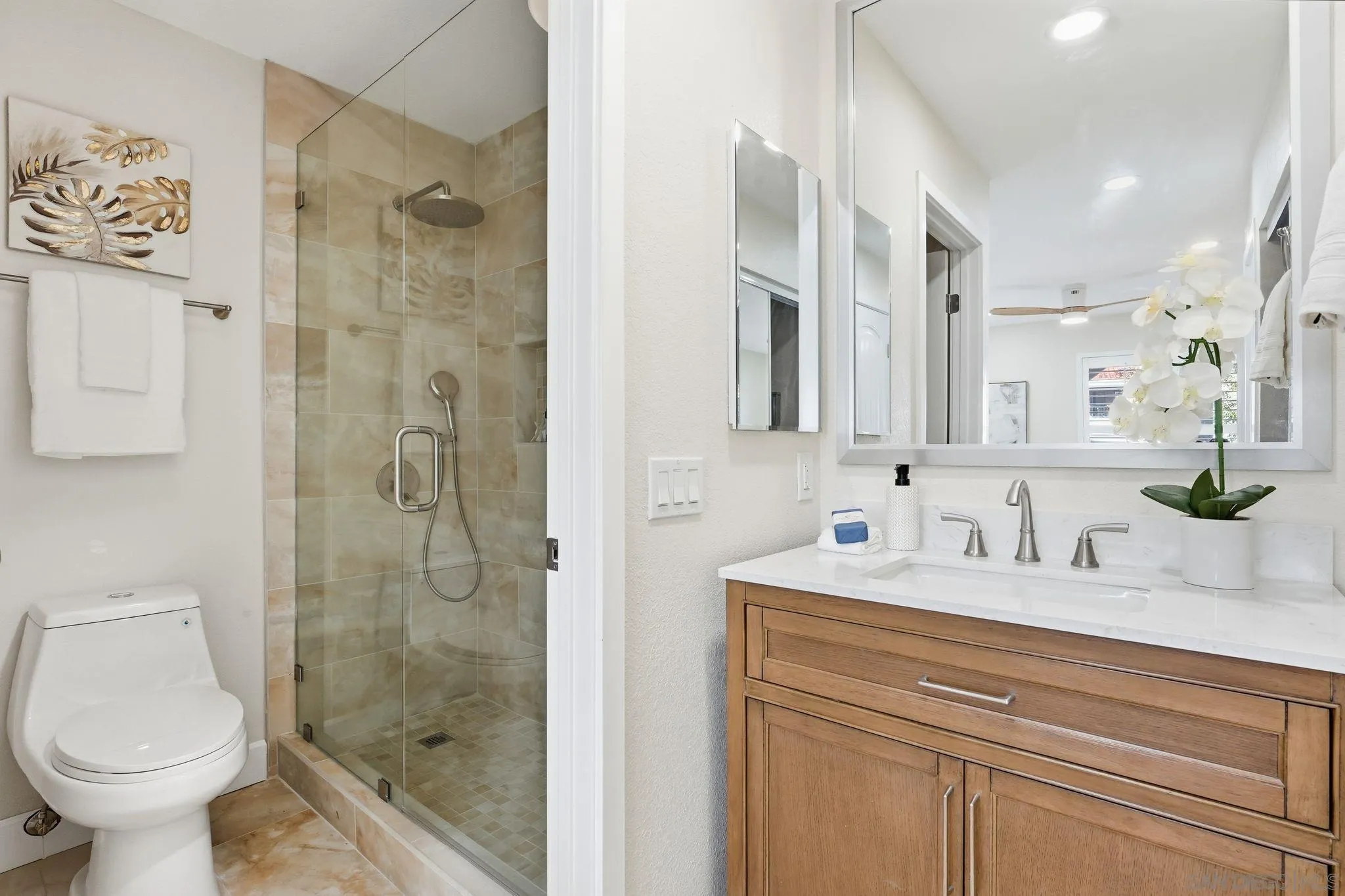 8480 New Salem Street, Unit 103 San Diego, CA 92126 - Photo 22 of 29 a bathroom with a sink toilet and shower