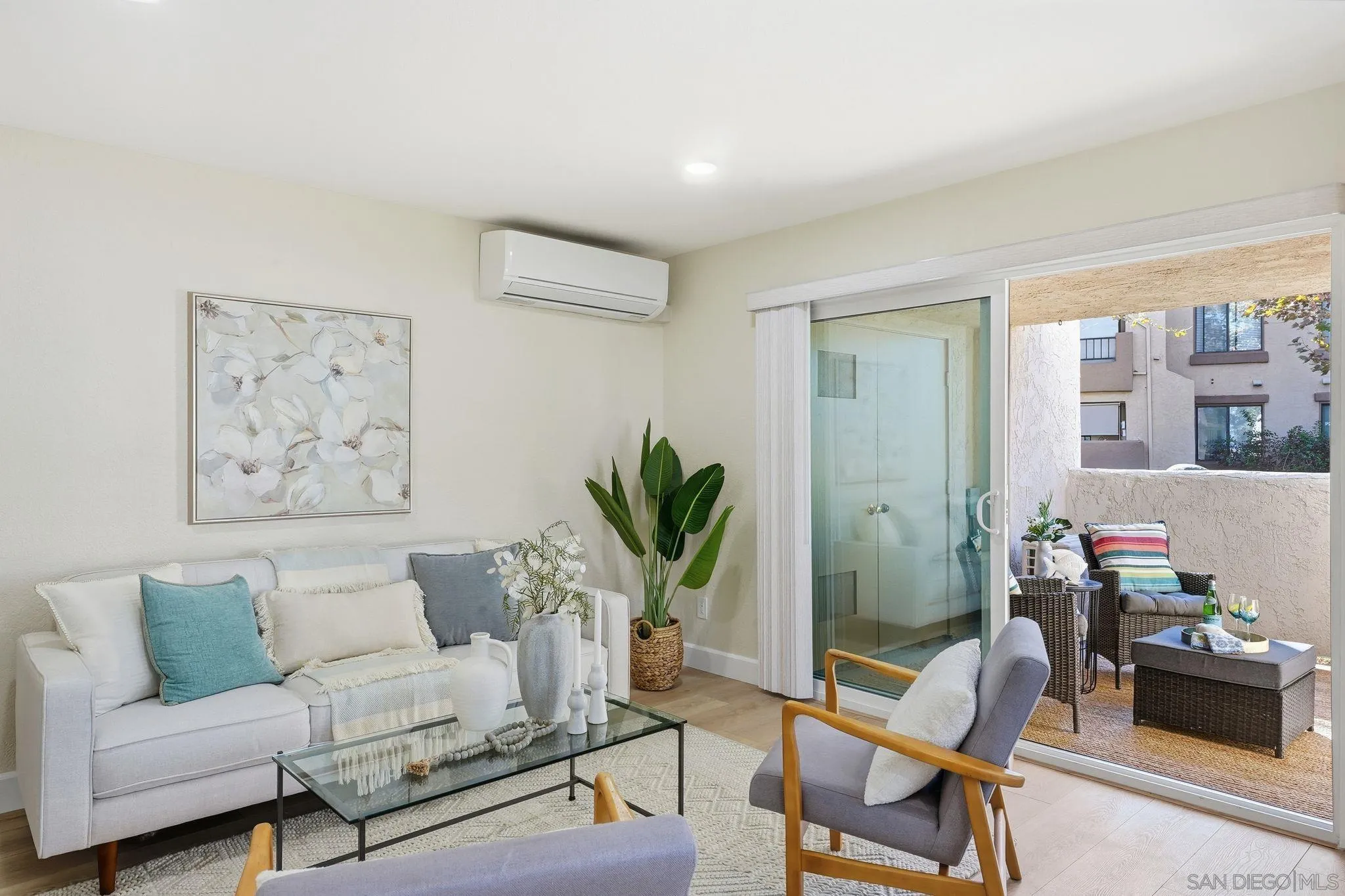 8480 New Salem Street, Unit 103 San Diego, CA 92126 - Photo 23 of 29 a living room with furniture and a potted plant