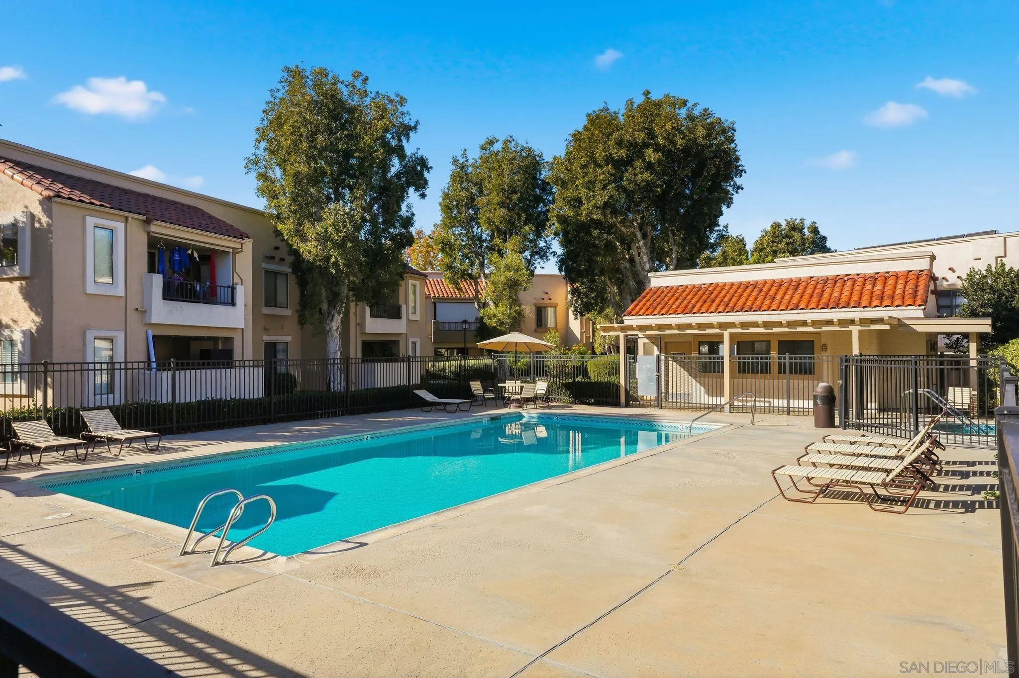 8480 New Salem Street, Unit 103 San Diego, CA 92126 - Photo 29 of 29 a view of a house with swimming pool and sitting area