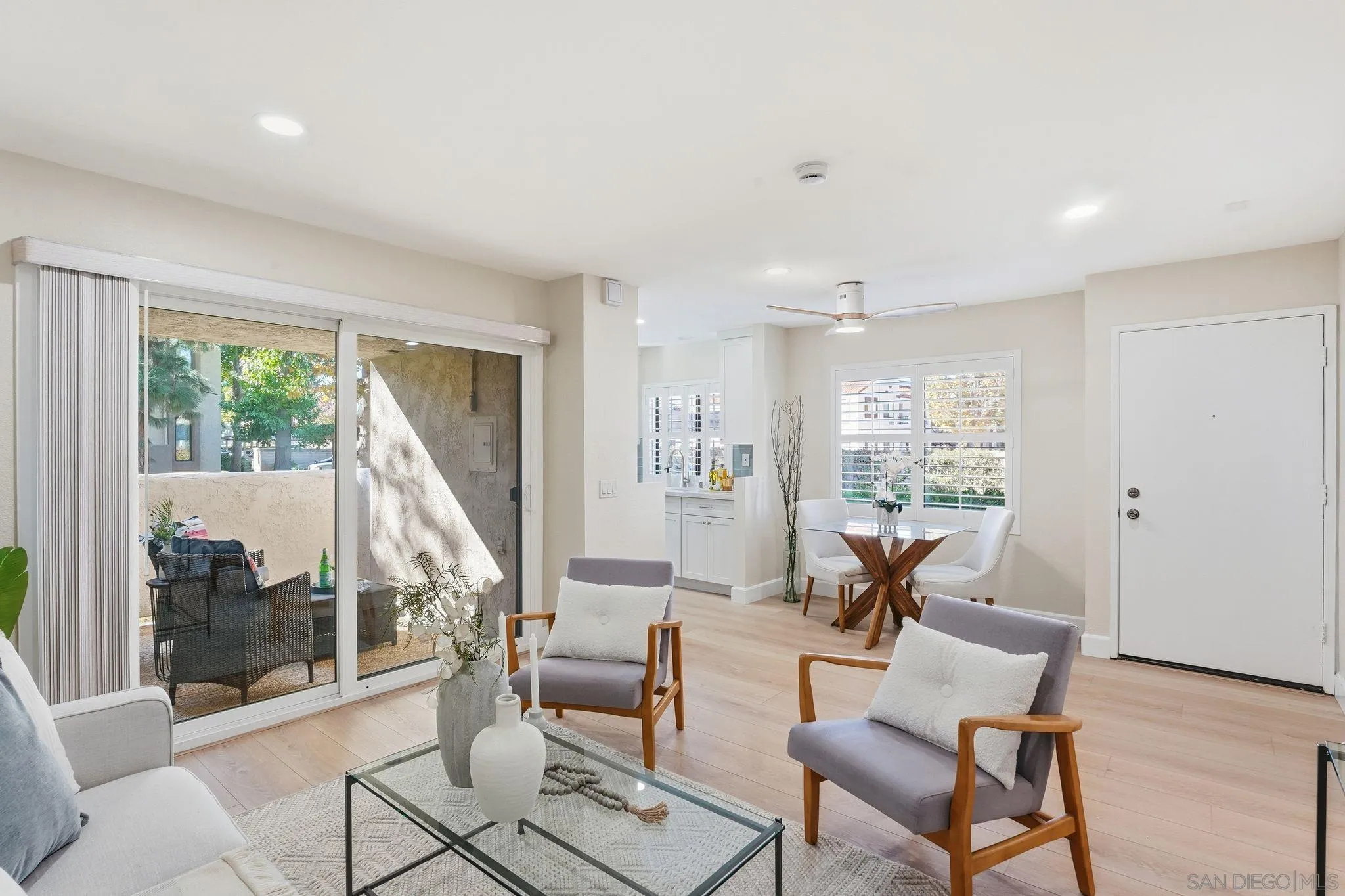 8480 New Salem Street, Unit 103 San Diego, CA 92126 - Photo 5 of 29 a living room with furniture and a large window