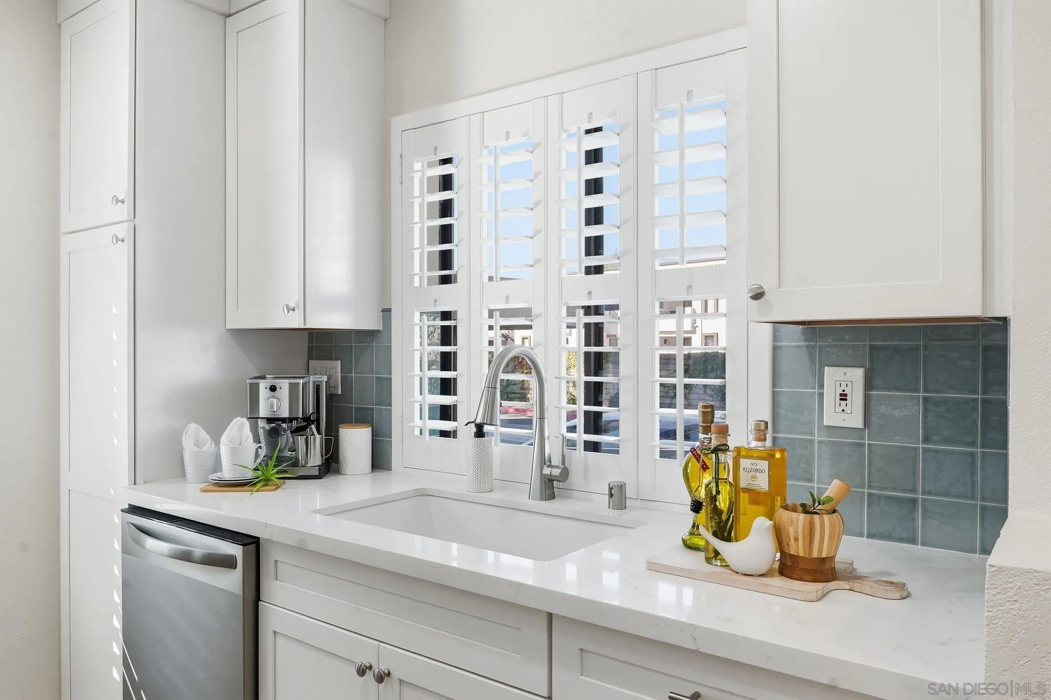 8480 New Salem Street, Unit 103 San Diego, CA 92126 - Photo 9 of 29 a kitchen with a sink and a window