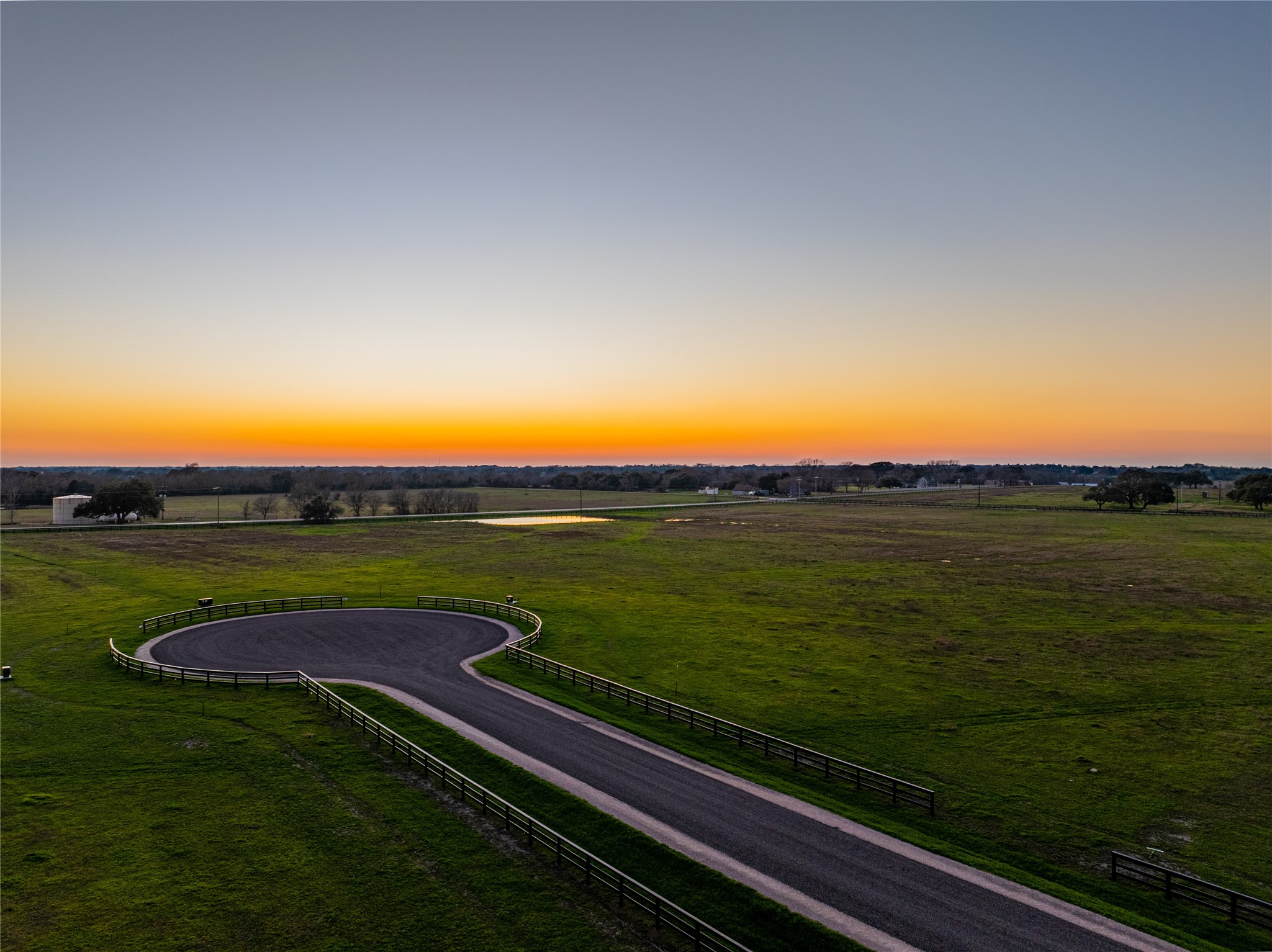 114 Hartfield Road Round Top, TX 78954 - Photo 15 of 18 a view of a lake with a garden