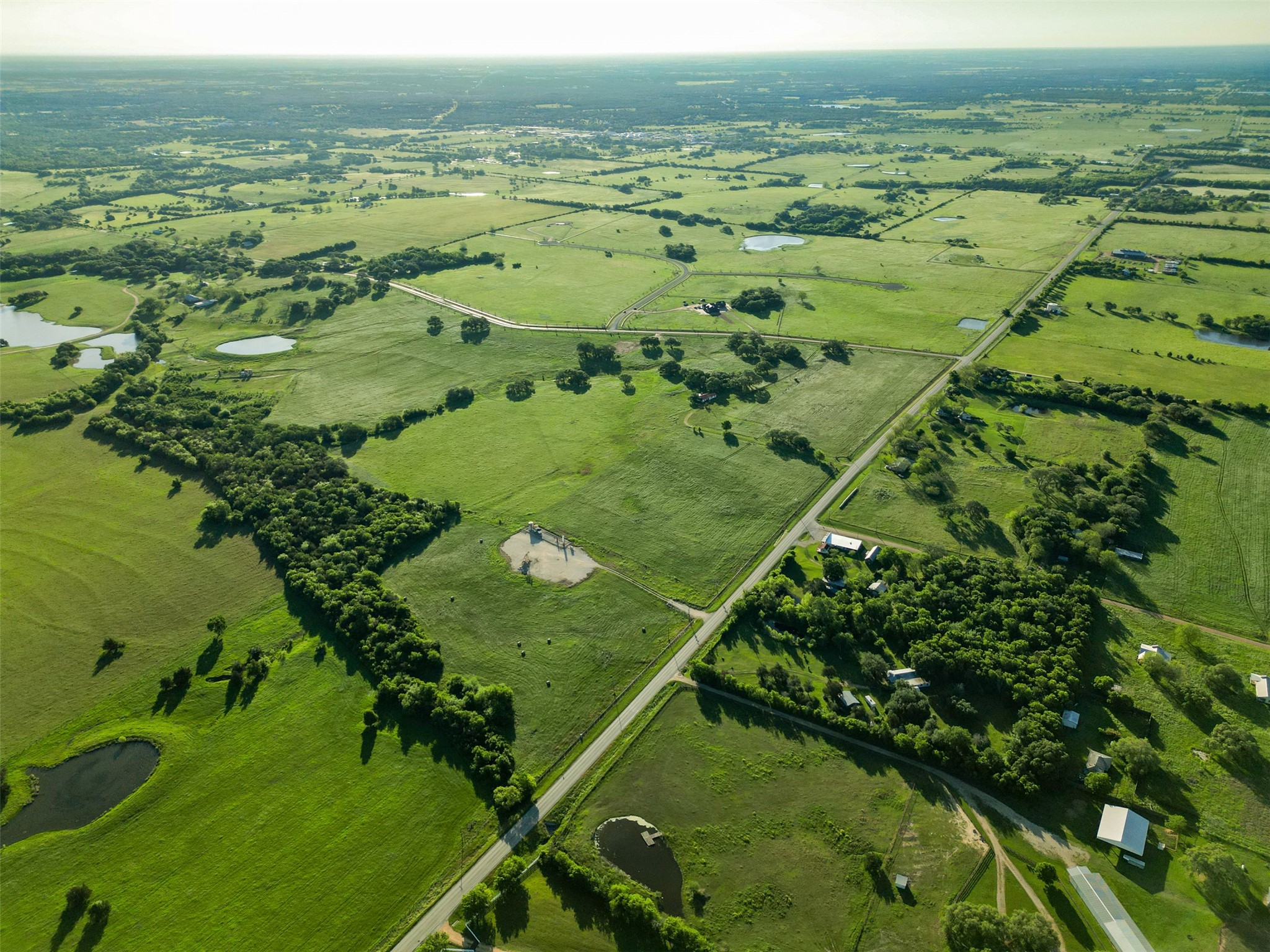 114 Hartfield Road Round Top, TX 78954 - Photo 4 of 18 a view of a green field