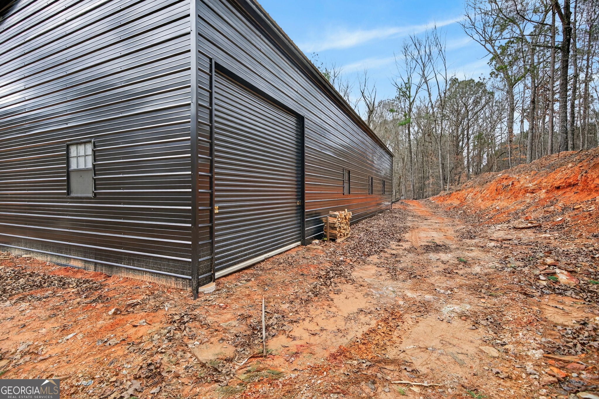 Tract 1 County Road 408 Heflin, AL 36264 - Photo 2 of 21 a backyard of a house with large trees