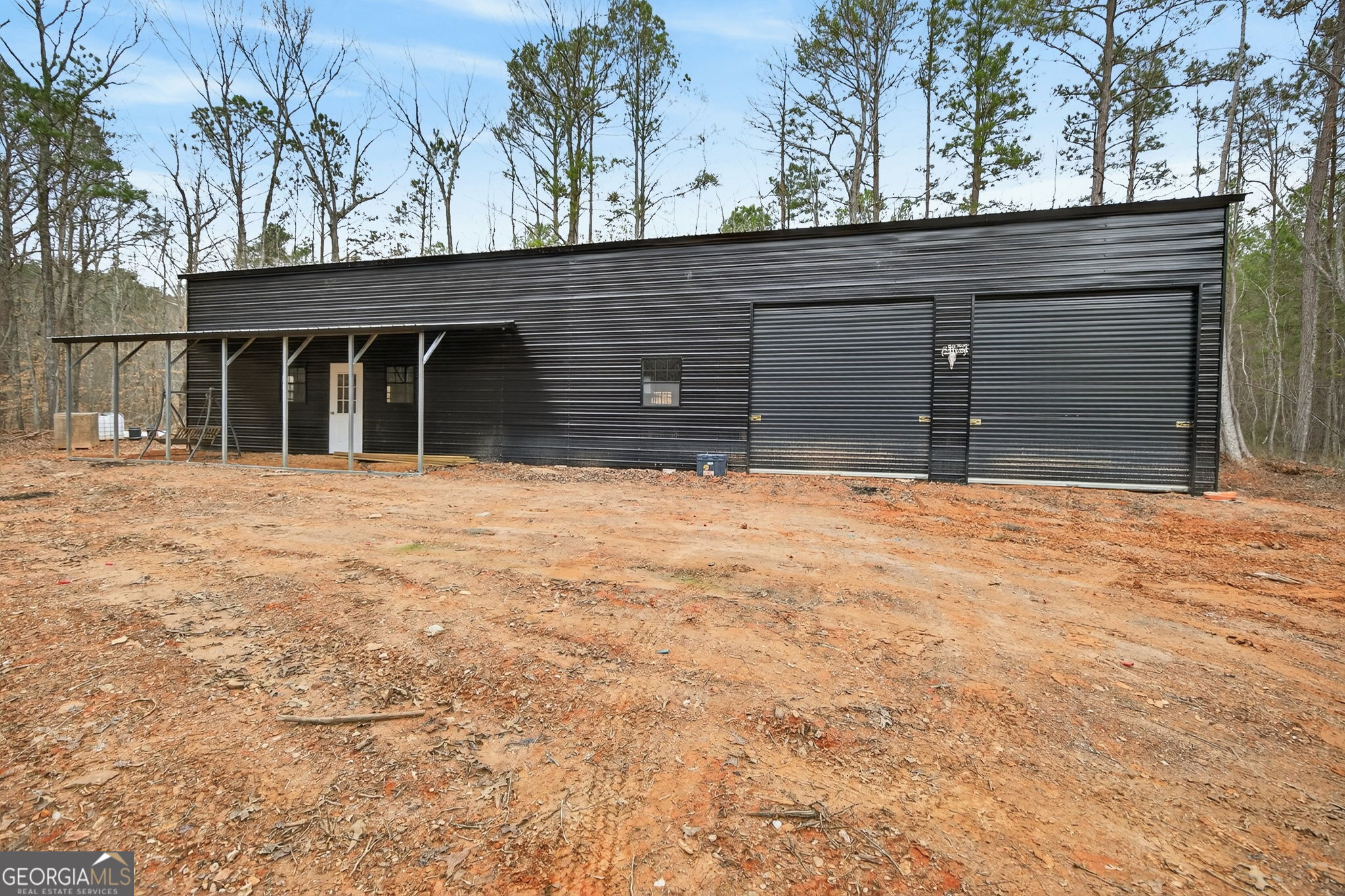 Tract 1 County Road 408 Heflin, AL 36264 - Photo 5 of 21 a house with trees in the background