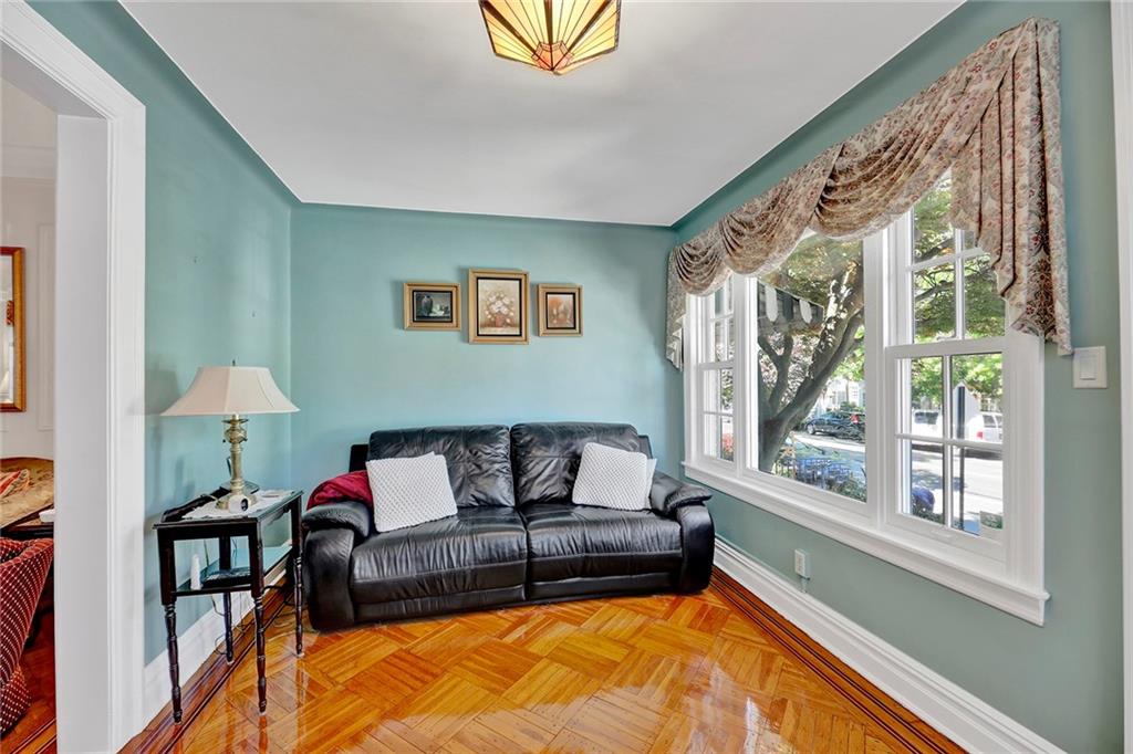 7607 Colonial Road Brooklyn, NY 11209 - Photo 3 of 35 a living room with furniture and a large window
