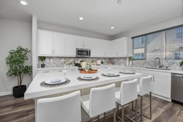 a kitchen with sink and cabinets
