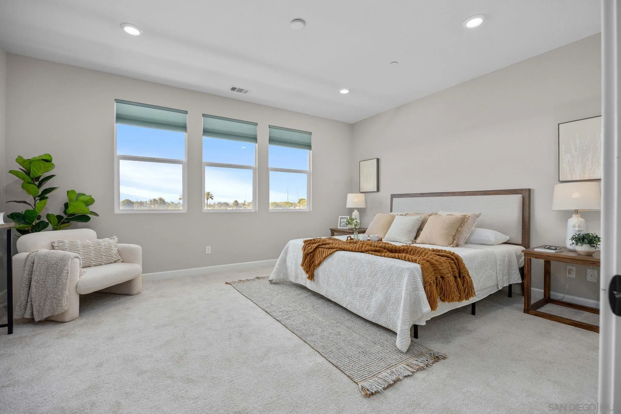 3574 Conner Way Oceanside, CA 92056 - Photo 20 of 52 a spacious bedroom with a bed and a couch