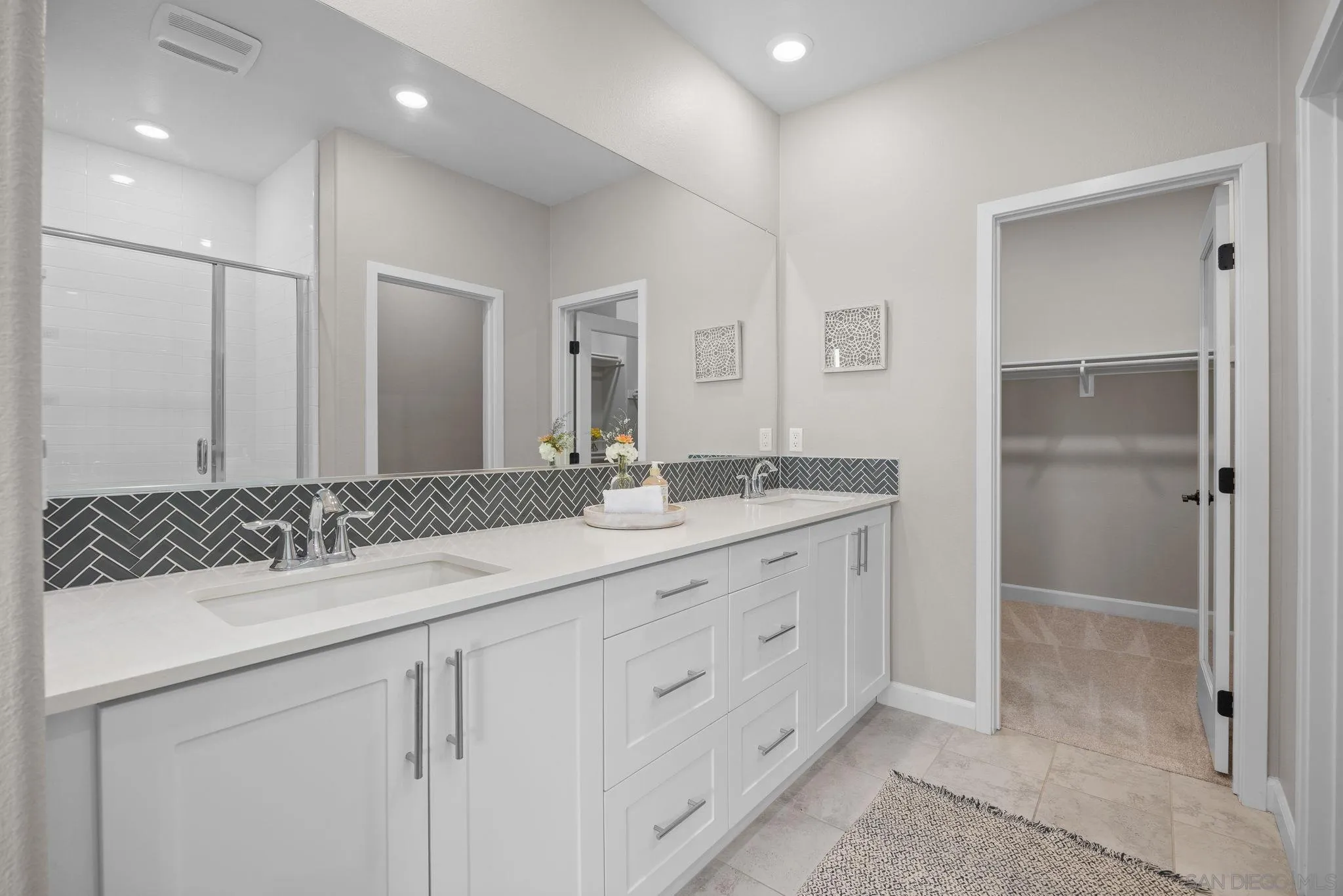 3574 Conner Way Oceanside, CA 92056 - Photo 22 of 52 a bathroom with a sink and a mirror