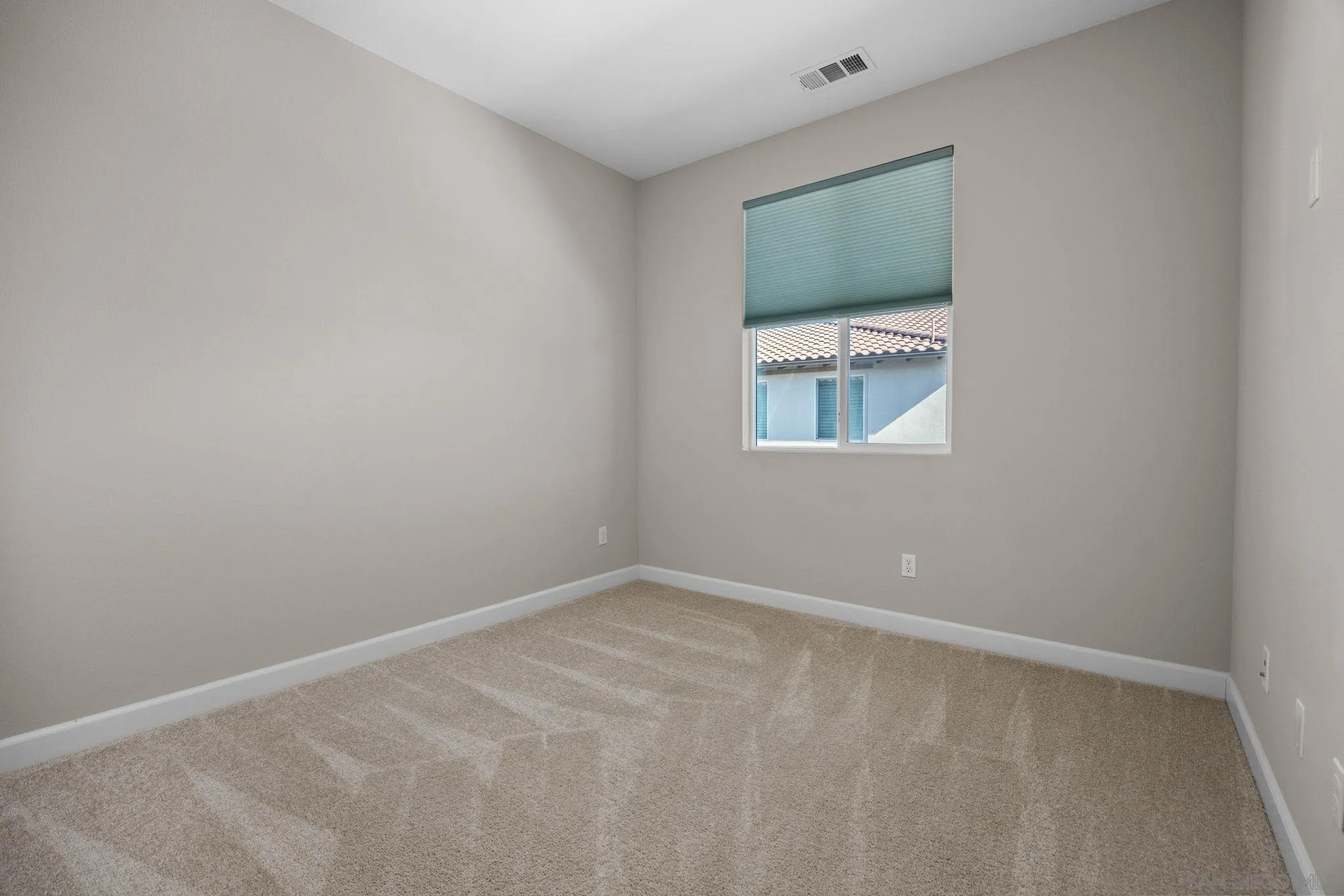 3574 Conner Way Oceanside, CA 92056 - Photo 24 of 52 an empty room with a window