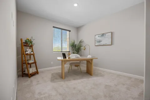 a view of a workspace with furniture and window in livingroom