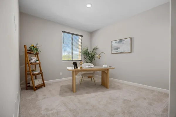 a view of a workspace with furniture and window in livingroom