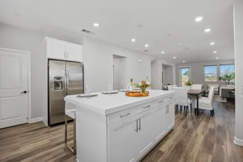 a bathroom with a sink a mirror and shower