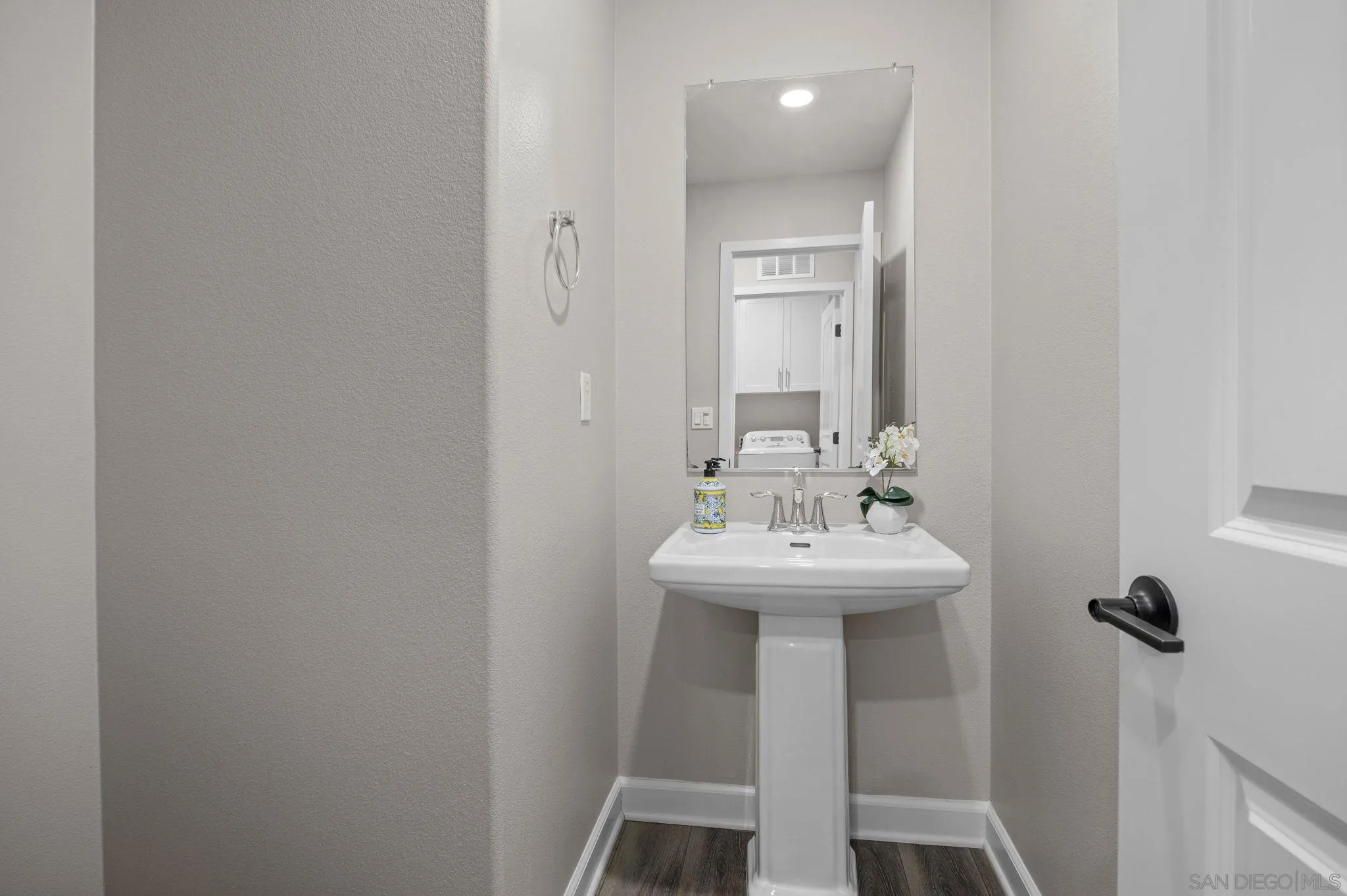 3574 Conner Way Oceanside, CA 92056 - Photo 44 of 52 a bathroom with a sink a mirror and shower