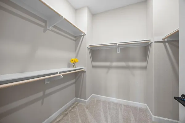 a view of a hallway with wooden floor and entryway