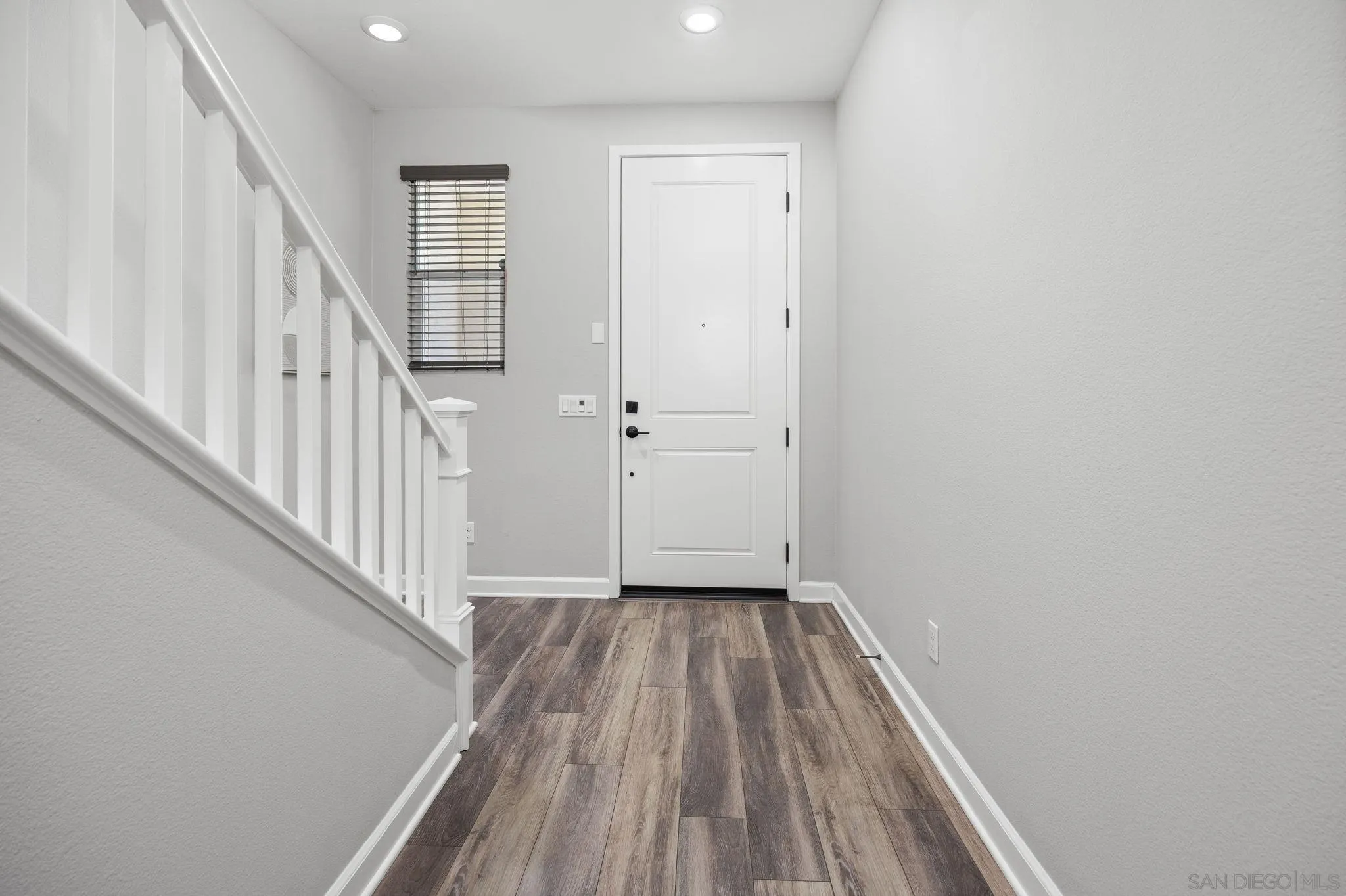 3574 Conner Way Oceanside, CA 92056 - Photo 49 of 52 a view of a hallway with wooden floor and entryway