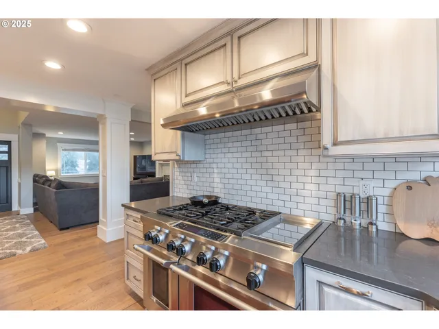 a kitchen with a stove and a sink