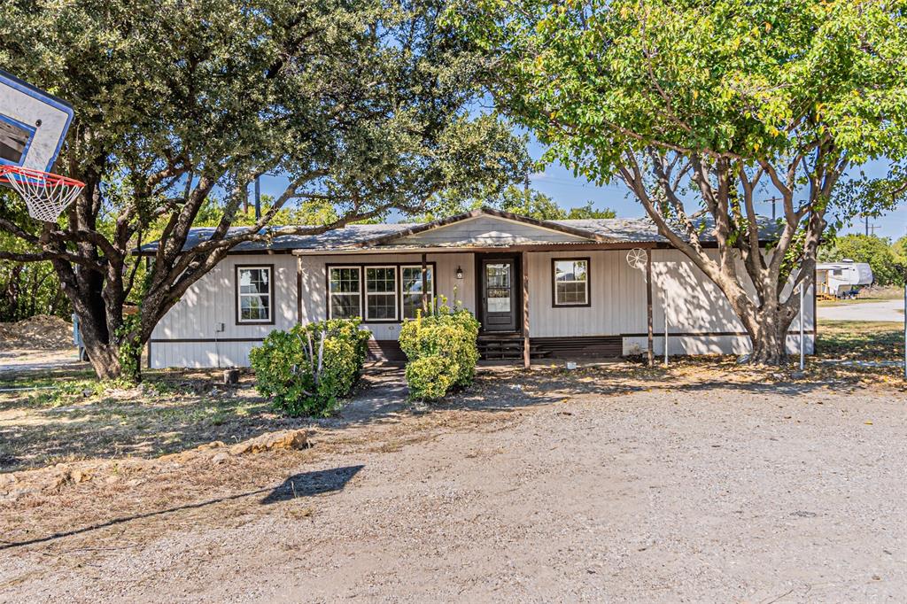 17381 Gaffield Road Justin, TX 76247 - Photo 1 of 38 a front view of a house with a garden