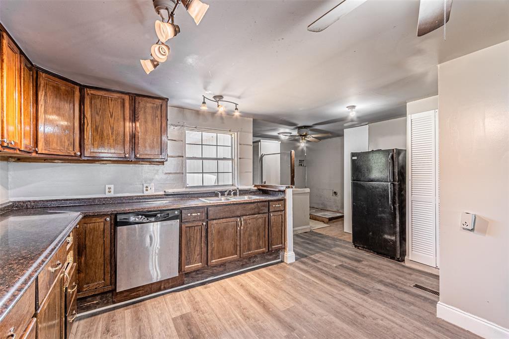 17381 Gaffield Road Justin, TX 76247 - Photo 16 of 38 a kitchen with stainless steel appliances granite countertop a stove and a refrigerator