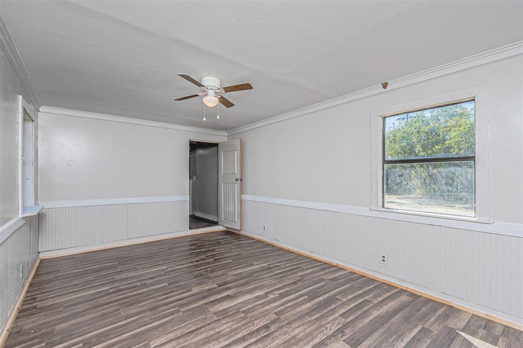 17381 Gaffield Road Justin, TX 76247 - Photo 20 of 38 a view of an empty room with a window and a ceiling fan