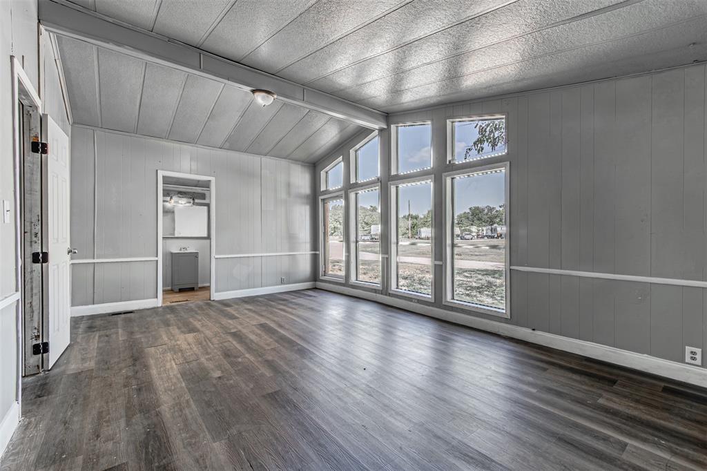 17381 Gaffield Road Justin, TX 76247 - Photo 23 of 38 wooden floor in an empty room with windows