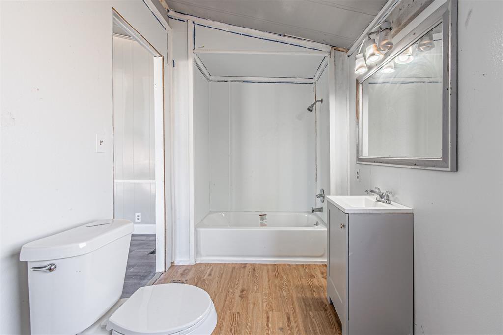 17381 Gaffield Road Justin, TX 76247 - Photo 25 of 38 a bathroom with a sink toilet and shower