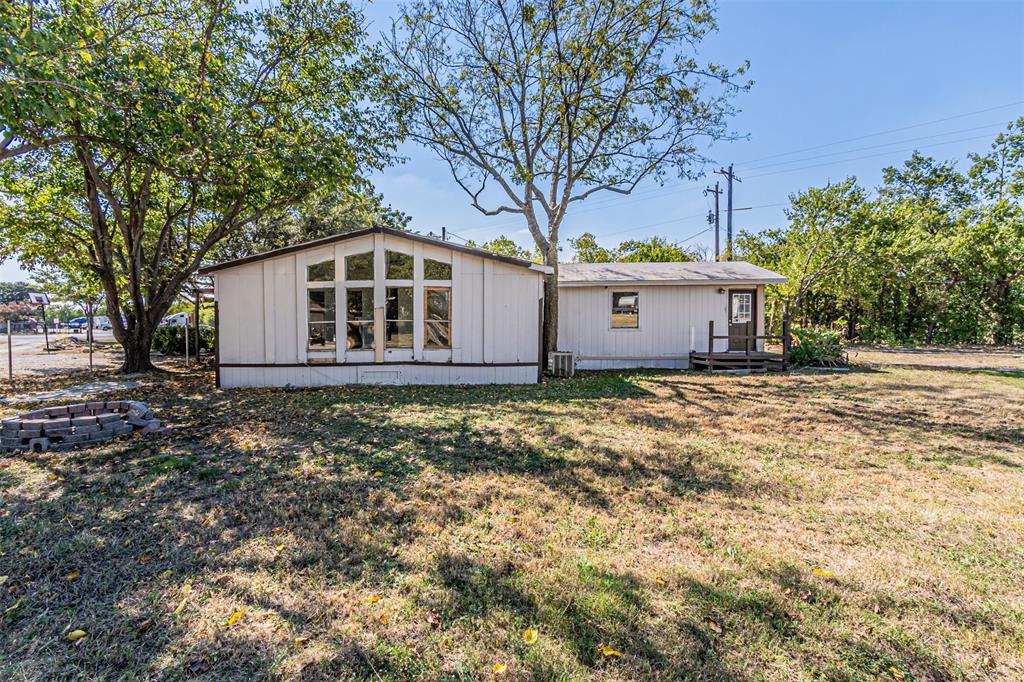 17381 Gaffield Road Justin, TX 76247 - Photo 32 of 38 a front view of a house with garden