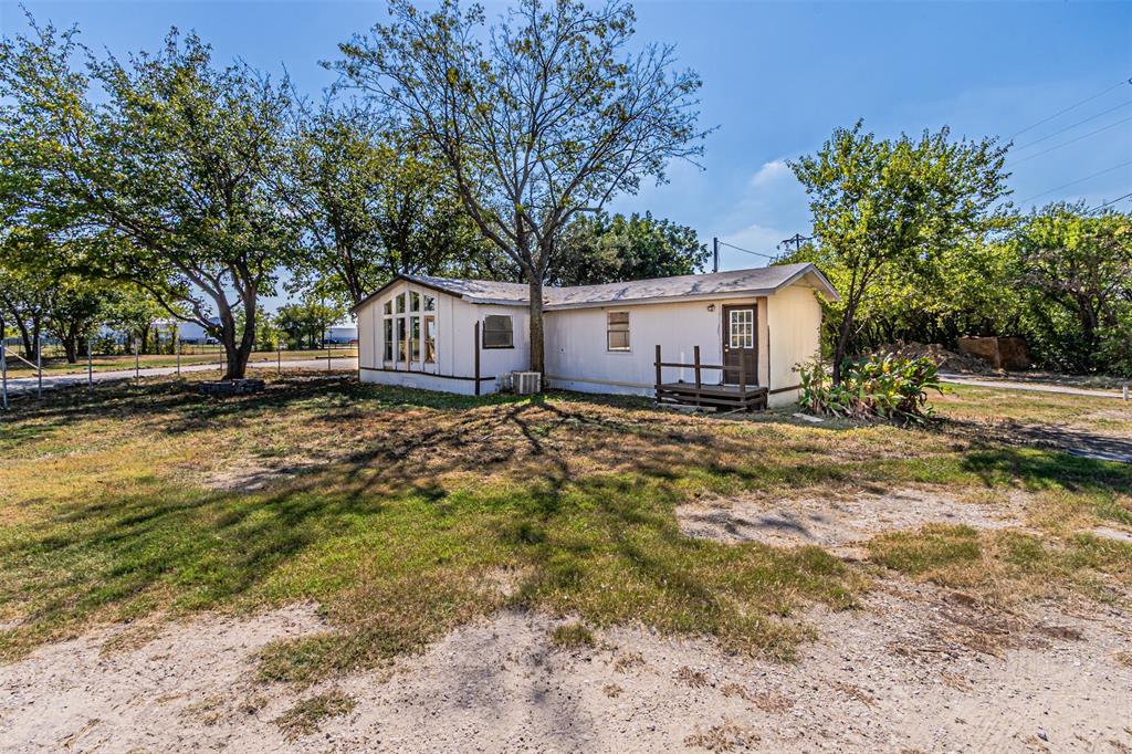 17381 Gaffield Road Justin, TX 76247 - Photo 33 of 38 a view of a house with a yard