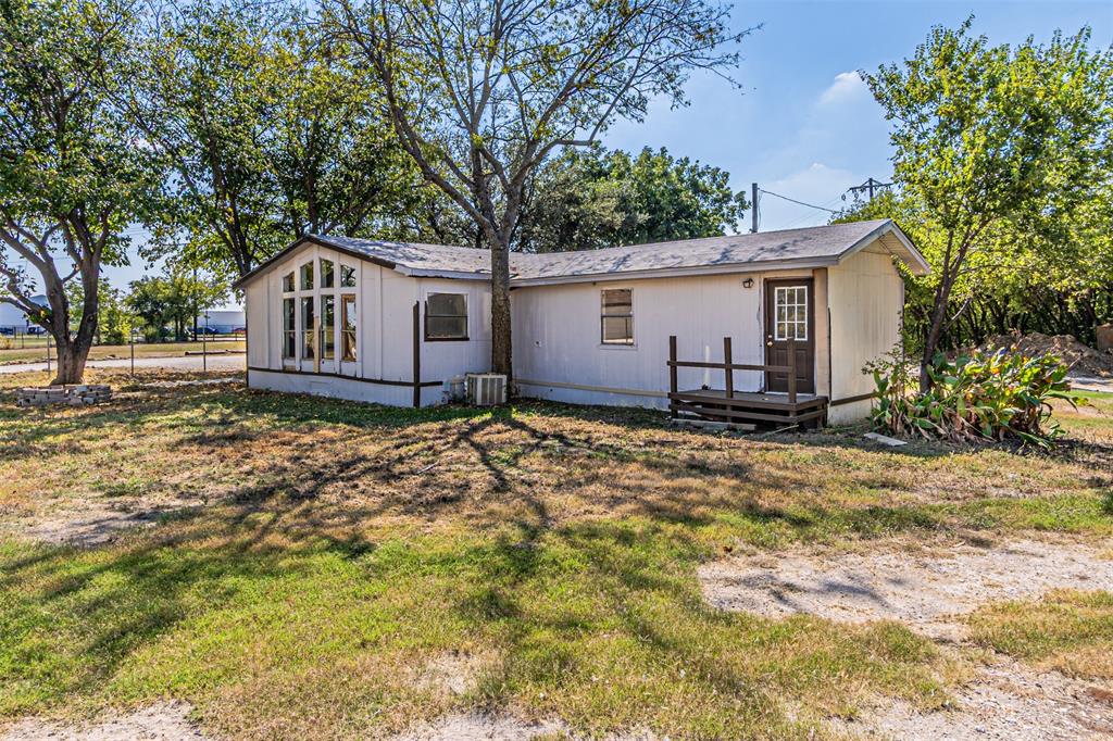 17381 Gaffield Road Justin, TX 76247 - Photo 34 of 38 a view of a house with a yard