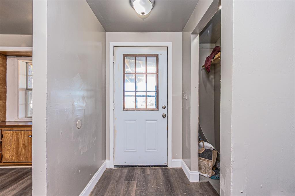 17381 Gaffield Road Justin, TX 76247 - Photo 6 of 38 a view of a hallway with wooden floor and a window