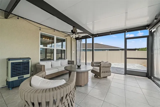 a lobby with furniture and floor to ceiling window