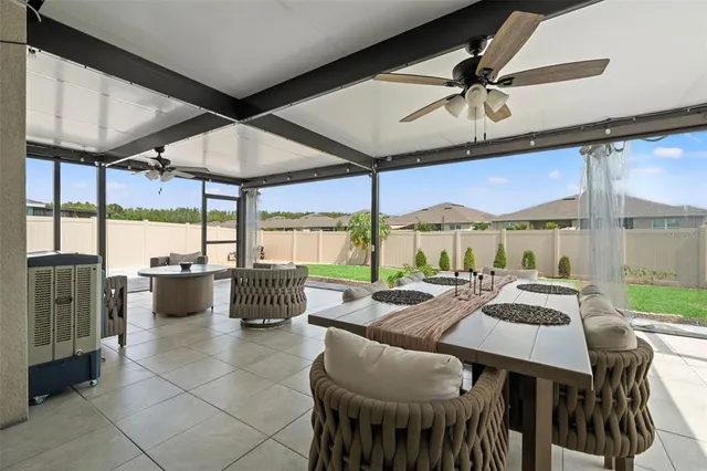 a outdoor space with a table and chairs
