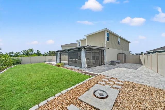 a view of a backyard with a garden and plants