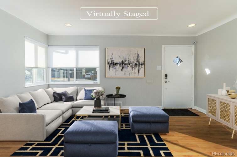 3040 Cook Street Denver, CO 80205 - Photo 2 of 19 a living room with furniture and a window
