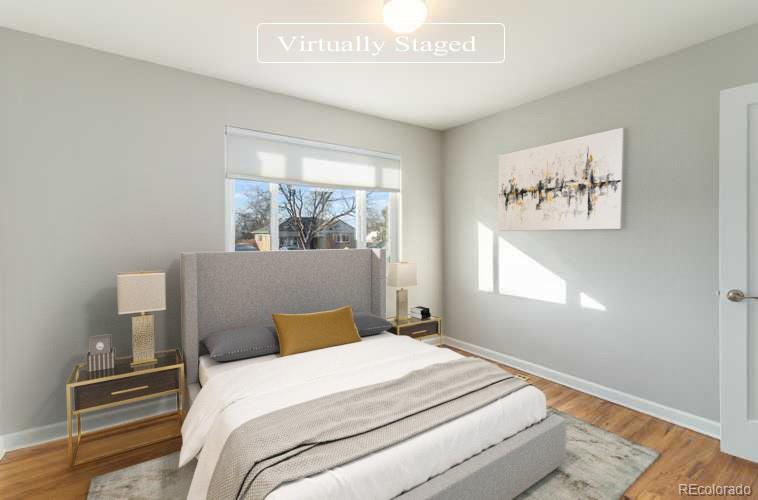 3040 Cook Street Denver, CO 80205 - Photo 3 of 19 a bedroom with a bed and a window