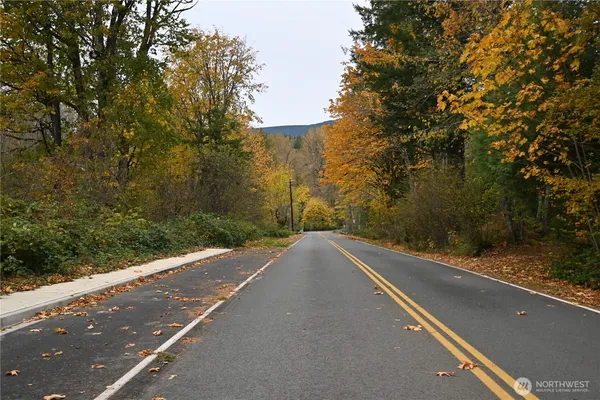 a view of a street with a building in the background