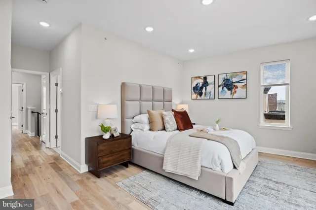 a bedroom with a bed and a chair