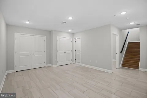 a bathroom with a sink vanity and a mirror