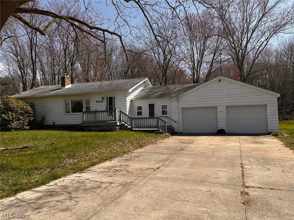 9526 Horn Road Windham, OH 44288 - Photo 1 of 14 Single story home featuring covered porch, a garage, and a front yard