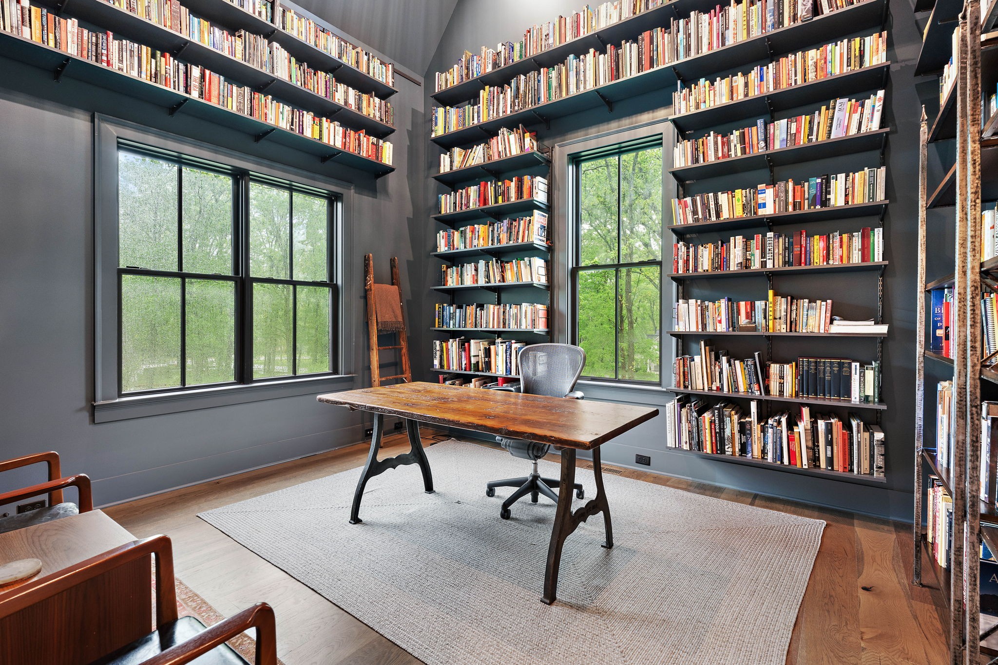 4340 Sneed Road Nashville, TN 37215 - Photo 17 of 49 a view of a workspace with furniture and a bookshelf