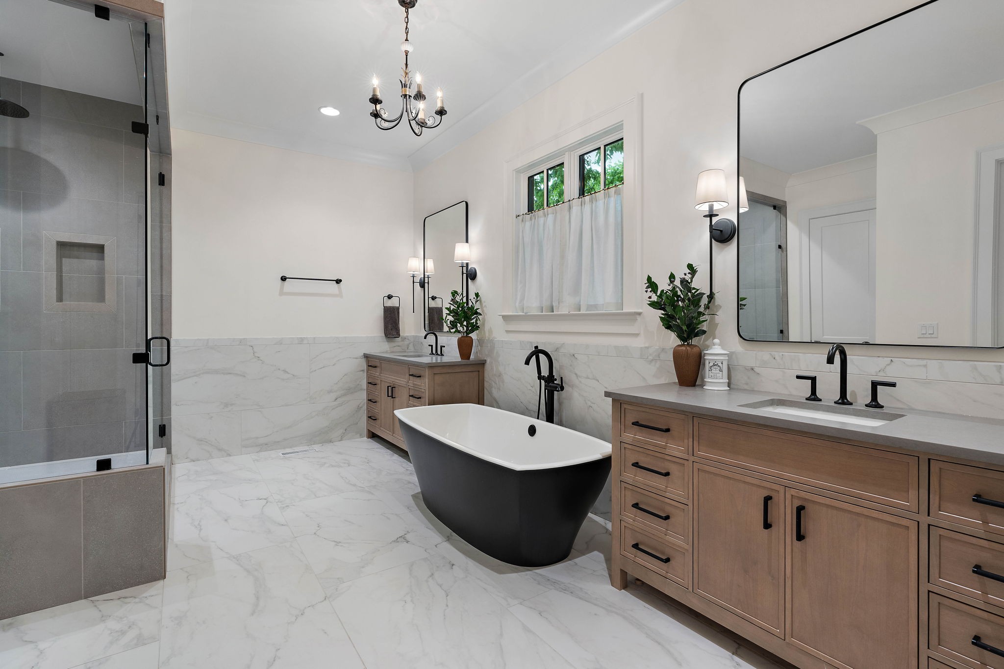 4340 Sneed Road Nashville, TN 37215 - Photo 24 of 49 a bathroom with a double vanity sink a mirror and a bathtub