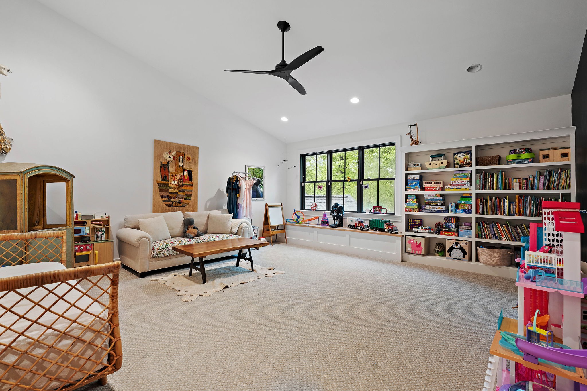 4340 Sneed Road Nashville, TN 37215 - Photo 37 of 49 a living room with lots of furniture and a book shelf