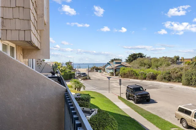 a view of a swimming pool with a patio and a yard