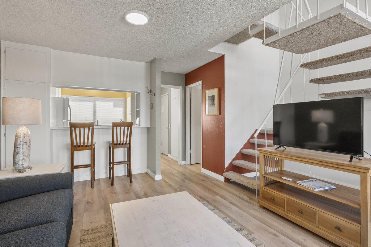 4700 Sandyland Road, Unit 23 Carpinteria, CA 93013 - Photo 11 of 26 a living room with furniture and a flat screen tv