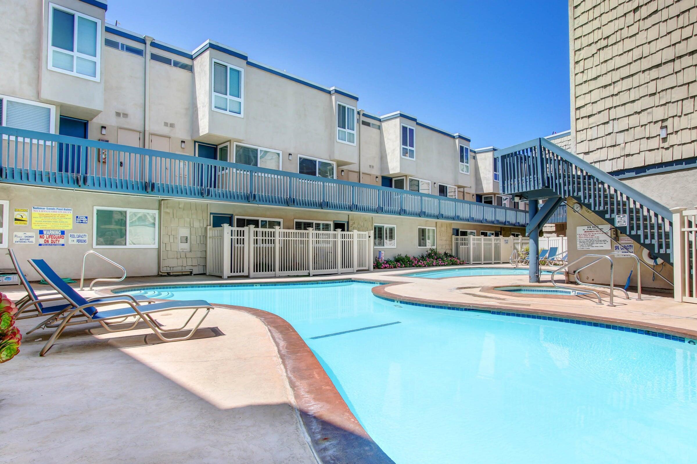 4700 Sandyland Road, Unit 23 Carpinteria, CA 93013 - Photo 22 of 26 a view of a swimming pool with a chair and tables