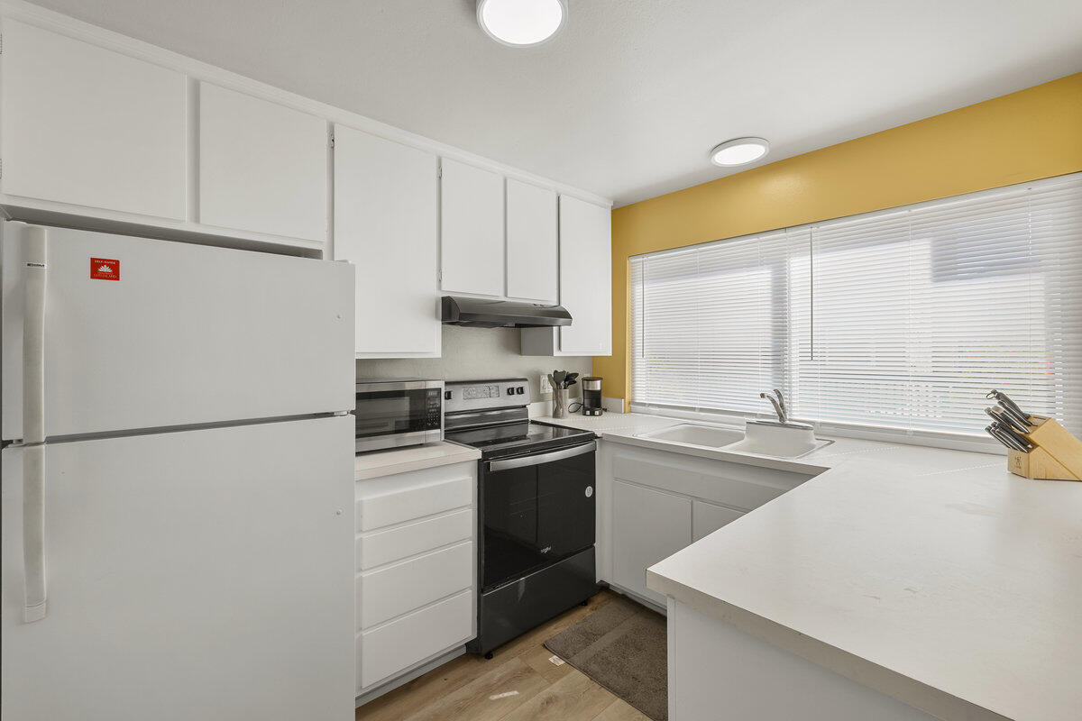 4700 Sandyland Road, Unit 23 Carpinteria, CA 93013 - Photo 6 of 26 a white refrigerator freezer sitting inside of a kitchen
