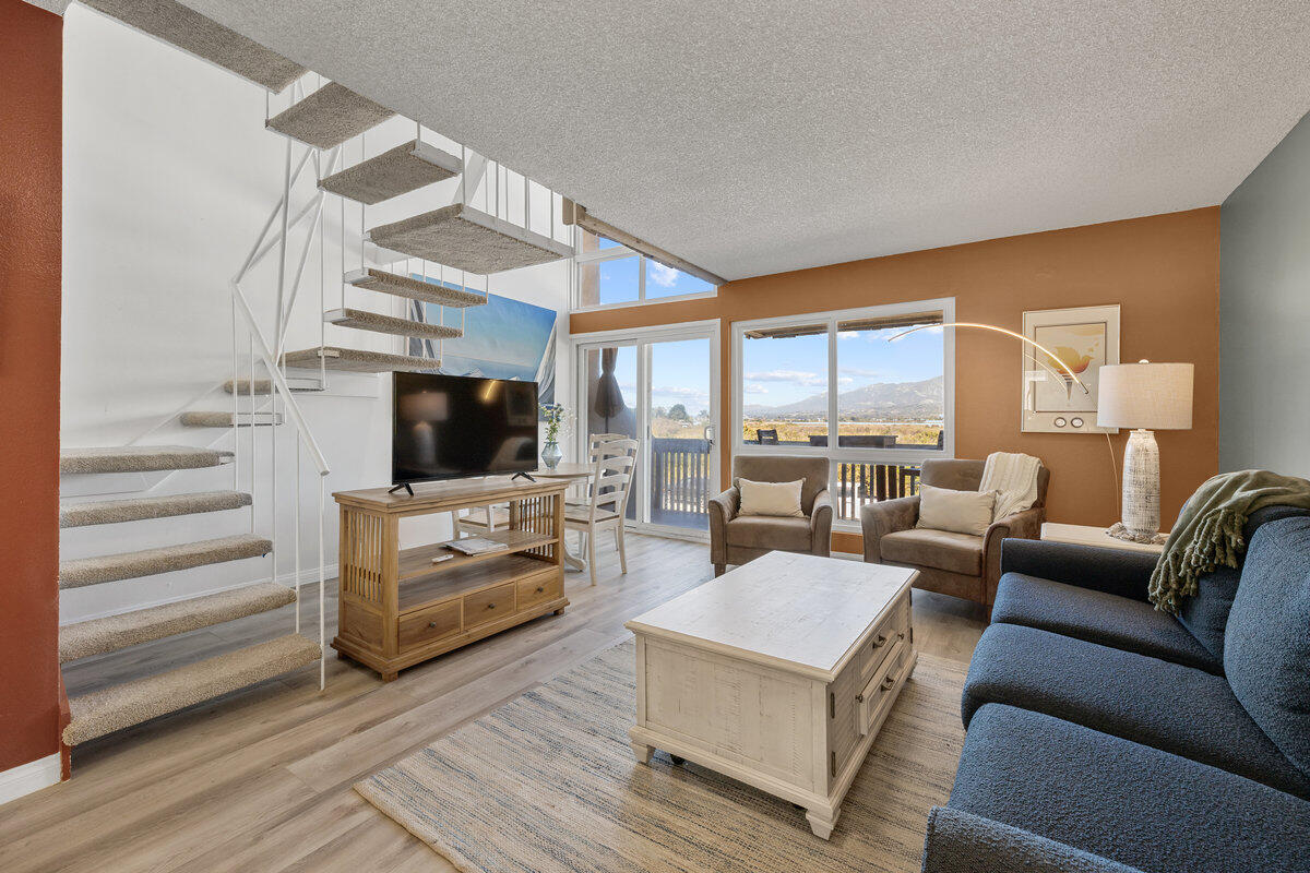 4700 Sandyland Road, Unit 23 Carpinteria, CA 93013 - Photo 9 of 26 a living room with furniture and a flat screen tv