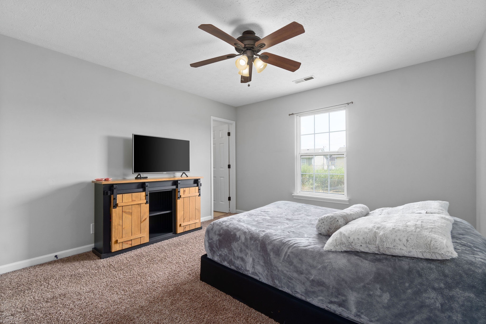 963 State Line Road Oak Grove, KY 42262 - Photo 23 of 33 a bedroom with a bed and a flat screen tv